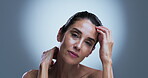 Dermatology, face or mature woman in studio, natural beauty or soft texture for anti aging treatment. Portrait, smooth skin or person with skincare for wellness, self care or space on gray background