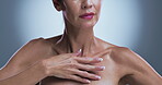 Body care, hands and skincare with woman in studio for cosmetics, dermatology or wellness. Aesthetic, beauty and manicure with model touching chest on gray background for benefits or results