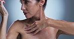 Body care, manicure and skincare with woman in studio for cosmetics, dermatology or wellness. Aesthetic, beauty and hands of mature model touching chest on gray background for benefits or results