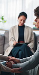 Couple, therapist and checklist for counselling, holding hands and help for support in office. Psychologist, man and woman support for advice, evaluation or notes for mental health consultation
