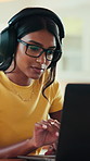 Home, headphones and woman with laptop, online and listen to music, creative and proofreading ebook. Freelancer, research and Indian person with tech for audio, remote work and editing story in house