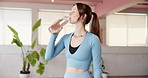 Woman, fitness and yoga with water for hydration, recovery or natural beverage in gym. Female person, yogi or thirst with aqua, mineral liquid or bottle for break, rest or drink in health club