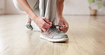 Woman, hands and tie shoes in gym to start workout, training or exercise. Fitness, athlete and tying footwear or sneakers for sport to get ready or prepare for cardio, health and wellness in club