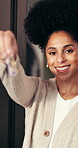 Face, woman and smile with keys at new house for real estate, property investment and celebration moment. Portrait, female person and happy for ownership, moving in and achievement with home purchase