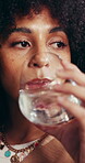 Woman, drinking and glass of water with pill for health benefits, iron supplement or multivitamin. Daily routine, immune support or person with tablet to improve brain function, hydration or wellness