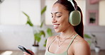 Smile, fitness and woman with smartphone, headphones and streaming app with wellness, podcast or audio. Song, exercise or healthy person with cellphone, radio or listening to music and playlist album