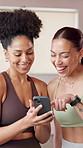 Happy woman, smartphone and friends with laugh at gym for fitness, contact and joke at pilates club. Person, phone and talk with meme, mobile app or comic video on social network at wellness class