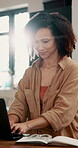 Typing, smile and woman in house with laptop, online networking or good review on blog post. Flare, happy and copywriter at table with tech, digital client conversation or positive feedback on script