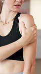 Gym, shoulder pain and woman in studio for yoga, pilates and exercise for wellness, health and mobility. Accident, massage and person with muscle strain, tension and inflammation for workout injury