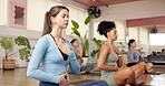Breathing, fitness and meditation with women in yoga class together for awareness or mindfulness. Balance, wellness and zen with group of holistic people in studio for inner peace or mental health