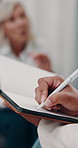 Hands, therapist and writing notes in counseling with mature woman, assessment or talk for mental health. People, psychologist and notebook with patient, consultation or discussion at wellness clinic