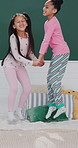 Girls, bed and jump with energy for fun in morning together with bonding or holiday connection, play or excited. Happy children, family and linen duvet in apartment for development, game and weekend