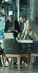 Boardroom, collaboration and laptop with business people in glass office together for development. Computer, conversation and planning with employee team in corporate workplace for project management