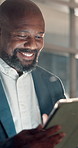 Night, smile and tablet with designer black man in office for development, planning or research. App, creative and reading with mature employee in dark workplace to complete design by deadline