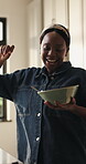 Dance, smile and breakfast with black woman in kitchen for nutrition, energy and music. Streaming, happiness and morning meal with female person eating in home for healthy food, vitamins and snack