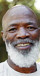 Face, hiking and smile of black man in nature for adventure, leisure hobby or sports activity. Explore, fitness and retirement with happy mature person outdoor in forest for exercise or wellness
