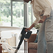 Vacuum, carpet and black woman in home for cleaning, maintenance and ...