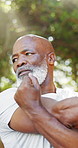 Stretching, fitness and mature black man in park to start exercise, training and workout for health. Nature, morning and person outdoor with arm warm up for wellness, active hobby and wellbeing