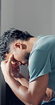 Headache, stress or tired with man in bedroom of home for burnout, fatigue or insomnia. Anxiety, depression and mental health with exhausted person in apartment for migraine or sleepless symptoms