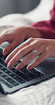 Hands, typing and woman in bed with laptop for social networking, platform research and remote work. Website management, communication and freelance content writer editing online report in home