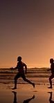 Senior friends, beach and running at sunset, playful and happy with race, waves and games in summer. Elderly people, group and outdoor for sprint challenge, exercise and space by ocean in retirement