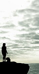 Thinking, man and silhouette for hiking on mountain for fitness, travel adventure and fresh air. Male person, dog and space for trekking journey, summit challenge and outdoor clouds to explore nature