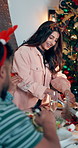 Christmas, friends and hosting lunch in home for celebration party, social gathering and cut meat. Xmas, group of people and dinner feast at dining table for festive event, holiday reunion or bonding