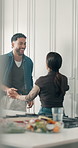 Happy, couple and dance in kitchen for love, anniversary celebration and energy. Music, man and woman moving in home with romantic rhythm, spin and holding hands together for healthy relationship