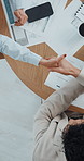 Agreement, meeting and handshake with business people for deal, merger and paperwork for project. Above, employee and shaking hands for collaboration with documents for investment and teamwork