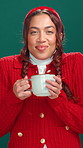 Christmas, face and woman in studio coffee and tasting with tradition on green background. Xmas, happiness and person with festive season, hot chocolate and eggnog with holiday, cosy and smile