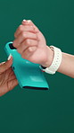 Hands, smart watch and pos in studio for transaction, deal or fintech app for tap on green background. People, iot and machine with mockup space, easy payment or financial freedom with discount sale