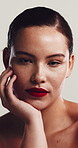 Makeup, face and red lipstick with woman in studio for beauty, salon and glow aesthetic. Dermatology, makeover and grooming with portrait of person on white background for shine and confidence