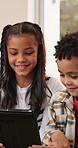 Tablet, happy and children in home with playing online game, bonding or watching movie in living room. Relax, digital technology and kid siblings streaming film, show or series on app in house.