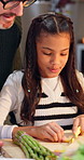 Cooking, cutting or learning with dad and daughter in kitchen of home together for bonding. Chop, knife or vegetables with girl child and single parent man in apartment for food, health or nutrition