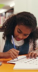Girl, student and writing with pencil for education, learning or childhood development in library. Child, kid or learner tracing with pattern for homework, assessment or motor skills in school