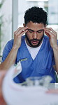 Man, nurse and meeting with team, stress and headache for crisis with hospital management in office. Person, medical professional and frustrated with healthcare job, talk or group in clinic boardroom