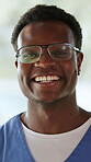 Face, happy man and doctor in hospital with pride for healthcare career, opportunity and internship. Black person male nurse and smile in clinic for medical service, patient support and about us.