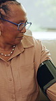 Blood pressure, medical and senior black woman on sofa in living room of home for appointment. Checkup, healthcare and sphygmomanometer with old African person in apartment for advice or consulting
