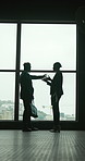 Business people, silhouette and discussion with window for corporate chat or arrangement. Man, woman or colleagues with bag for travel proposal, career opportunity or negotiation in company building