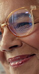 Closeup, face and senior woman in home with thinking, reflection and memory of good times. Happiness, flashback and female person in house with smile, emotional thoughts and mindset in retirement.