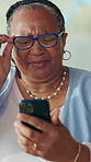 Phone, confused and senior black woman in home with reading online news bulletin on mobile app. Technology, relax and African elderly female person in retirement with blog on cellphone in living room