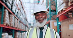 Face, distribution and black man in factory, smile and confidence with supply chain. Storage facility, employee and mature person in warehouse, pride and inventory for export, logistics or inspection