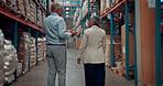 Logistics, walking and back of business people in warehouse with inspection, inventory or order. Discussion, planning and supply chain managers with cargo distribution in collaboration at storehouse.