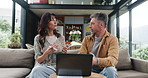 Laptop, discussion and interior designer with client in house for planning creative project together. Conversation, computer and people with ideas for research on technology in living room at home.