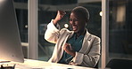 Black woman, fist pump and celebration at office, night and excited with project approval at media company. Person, writer and happy with goals, applause and notification for journalist award on web