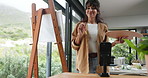 Phone, live streaming and woman painting with art for creativity, social media or online tips. Influencer, artist or mature content creator at easel for video broadcast, advice or vlog in home studio