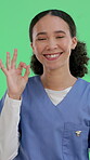 Okay sign, nurse and face of woman on green screen for healthcare, about us and fertility clinic assistant. Medical professional, success and happy with person on studio background for obstetrics