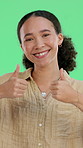 Face, smile and woman with thumbs up on green screen for success, yes or agreement in studio. Portrait, happy model and like hand gesture for feedback emoji, recommendation or thank you on background