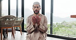 Muslim, man and praying salaah for worship, faith or prayer hands with Islam in home. Respect, devotion and Islamic person in house for gratitude, trust in God or Allah for religion with praise