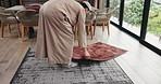 Prayer mat, man and start in home for muslim religion, worship and praise to Allah with mindfulness. Spiritual, faith and person in islam for peace, praying and gratitude or Qibla direction in house
